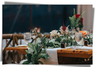 Wedding reception farmhouse table, roses, greenery garland